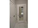 White door with mirror reflecting an open room at 20797 Racine St, Orlando, FL 32833