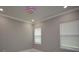 Well-lit bedroom featuring two windows with blinds and a ceiling fan at 20797 Racine St, Orlando, FL 32833