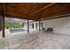 Relaxing pool area with thatched roof cover, pavers, and screened enclosure at 20797 Racine St, Orlando, FL 32833