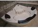 Modern corner jacuzzi tub with comfortable headrests at 20797 Racine St, Orlando, FL 32833