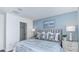 Main bedroom with a blue accent wall and a comfortable king-size bed at 195 River Front Way, Edgewater, FL 32141