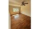 Bedroom with wood-look flooring and large window at 1944 Conway Rd # 6, Orlando, FL 32812