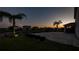 Backyard patio at sunset, overlooking the lake at 4950 Chase Ct, Saint Cloud, FL 34772