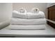 Stack of fresh white towels at 6165 Carrier Dr # 1210, Orlando, FL 32819