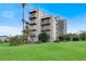 Modern building with balconies and lush lawn at 6165 Carrier Dr # 1210, Orlando, FL 32819