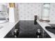 Sleek, black electric cooktop with modern design at 6165 Carrier Dr # 1210, Orlando, FL 32819