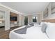 Bedroom with two beds, a home office, and a view of the balcony at 6165 Carrier Dr # 1210, Orlando, FL 32819