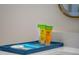 Guest toiletries on a blue tray at 6165 Carrier Dr # 1210, Orlando, FL 32819