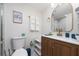 Modern bathroom with marble shower and gold fixtures at 6165 Carrier Dr # 1210, Orlando, FL 32819