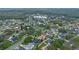 Aerial view of a house in a residential neighborhood, easily identifiable by the marker at 1451 Twin Rivers Blvd, Oviedo, FL 32766