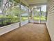 Bright screened porch overlooking the backyard at 821 Dundee Cir, Leesburg, FL 34788