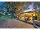Expansive deck with outdoor seating and a view of the backyard at 2075 Genova Dr, Oviedo, FL 32765