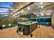 Covered hot tub with surrounding patio and lush landscaping at 2075 Genova Dr, Oviedo, FL 32765