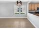 Bright dining area with tile floors and kitchen access at 1563 Reflection Cv, Saint Cloud, FL 34771