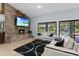 Bright community room with fireplace and large TV at 11 Escondido Cir # 105, Altamonte Springs, FL 32701
