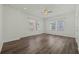 Large bedroom with wood-look floors and neutral decor at 1509 Lobelia Dr, Lake Mary, FL 32746