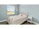 Bedroom with white metal bed frame and hardwood floors at 8632 Bridgeport Bay Cir, Mount Dora, FL 32757