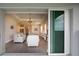 Bright living room with view into kitchen and dining area at 8632 Bridgeport Bay Cir, Mount Dora, FL 32757