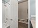 Bathroom with a shower/tub combo and white door at 8632 Bridgeport Bay Cir, Mount Dora, FL 32757