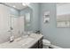 Bathroom with granite countertop and single sink vanity at 8632 Bridgeport Bay Cir, Mount Dora, FL 32757