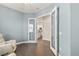 Home office with glass french doors and hardwood floors at 8632 Bridgeport Bay Cir, Mount Dora, FL 32757