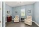 Relaxing office with two armchairs and hardwood floors at 8632 Bridgeport Bay Cir, Mount Dora, FL 32757