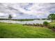 Stunning lake view with lush landscaping at 8632 Bridgeport Bay Cir, Mount Dora, FL 32757