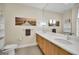 Double vanity bathroom with modern finishes and large mirror at 17349 Serenidad Blvd, Clermont, FL 34714