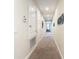 Hallway with carpet and access to bedrooms at 7703 Banyon Way, Kissimmee, FL 34747