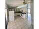 Kitchen with white cabinets and tile floors at 733 Robin Ct, Kissimmee, FL 34759