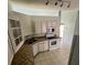 Kitchen with white cabinets and tile countertops at 733 Robin Ct, Kissimmee, FL 34759