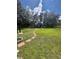 Large backyard with stone pathway leading to a shed at 733 Robin Ct, Kissimmee, FL 34759