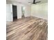 Spacious bedroom with wood-look floors and ample closet space at 733 Robin Ct, Kissimmee, FL 34759