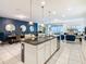 Open concept kitchen with white cabinets and large island at 8844 Corcovado Dr, Kissimmee, FL 34747