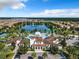 Resort-style community pool with a clubhouse and lake views at 8844 Corcovado Dr, Kissimmee, FL 34747
