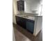 Modern kitchen with stainless steel appliances and granite counters at 4400 Thornbriar Ln # A202, Orlando, FL 32822