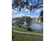 Serene lake with fountains and lush landscaping at 4400 Thornbriar Ln # A202, Orlando, FL 32822