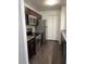 Modern kitchen with stainless steel appliances and granite counters at 4400 Thornbriar Ln # A202, Orlando, FL 32822