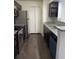 Modern kitchen with stainless steel appliances and granite counters at 4400 Thornbriar Ln # A202, Orlando, FL 32822