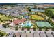 Aerial view of community with pool, tennis courts, and homes at 9562 Meadow Hunt Way, Winter Garden, FL 34787