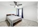 Spacious bedroom with a queen bed and ceiling fan at 5616 Arborvista Dr, St Cloud, FL 34771
