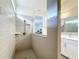 Large walk-in shower with glass enclosure and neutral tile at 5616 Arborvista Dr, St Cloud, FL 34771