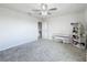 Spacious bedroom with a built-in shelving unit and piano at 5616 Arborvista Dr, St Cloud, FL 34771