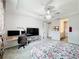Bedroom with king-size bed, workspace, and ensuite bathroom at 5616 Arborvista Dr, St Cloud, FL 34771