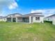 Large backyard with a screened patio at 5616 Arborvista Dr, St Cloud, FL 34771