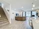 Open living area with a large sectional sofa, tile floors, and access to the backyard at 5616 Arborvista Dr, St Cloud, FL 34771