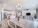 Bright dining room with a large table and chandelier at 5616 Arborvista Dr, St Cloud, FL 34771
