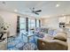 Living area with sectional sofa, sliding doors to backyard, and stylish rug at 5616 Arborvista Dr, St Cloud, FL 34771