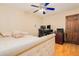 Bedroom with a queen bed, ceiling fan and wood dresser at 894 Quarters Ct, Port Orange, FL 32129