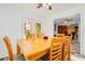 Light and airy dining room with wood table and access to backyard at 894 Quarters Ct, Port Orange, FL 32129